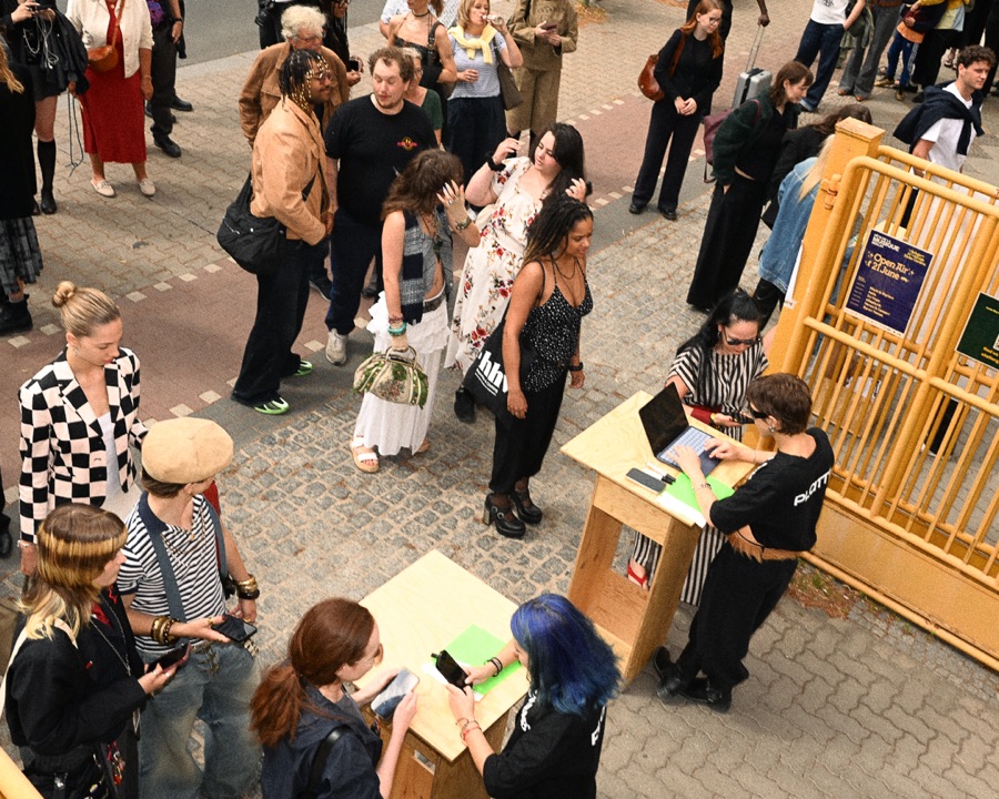 Guests arriving at the check-in desk before the show